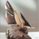 Scultura di Alessandro Starc realizzata nel 2013 che rappresenta una Barca lignea su base di bronzo