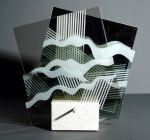 Scultura ad assetto variabile in vetro e specchio sabbiato di cm.35x31x16 denominata Onda su onda realizzata da Claudio Sivini nel 2010